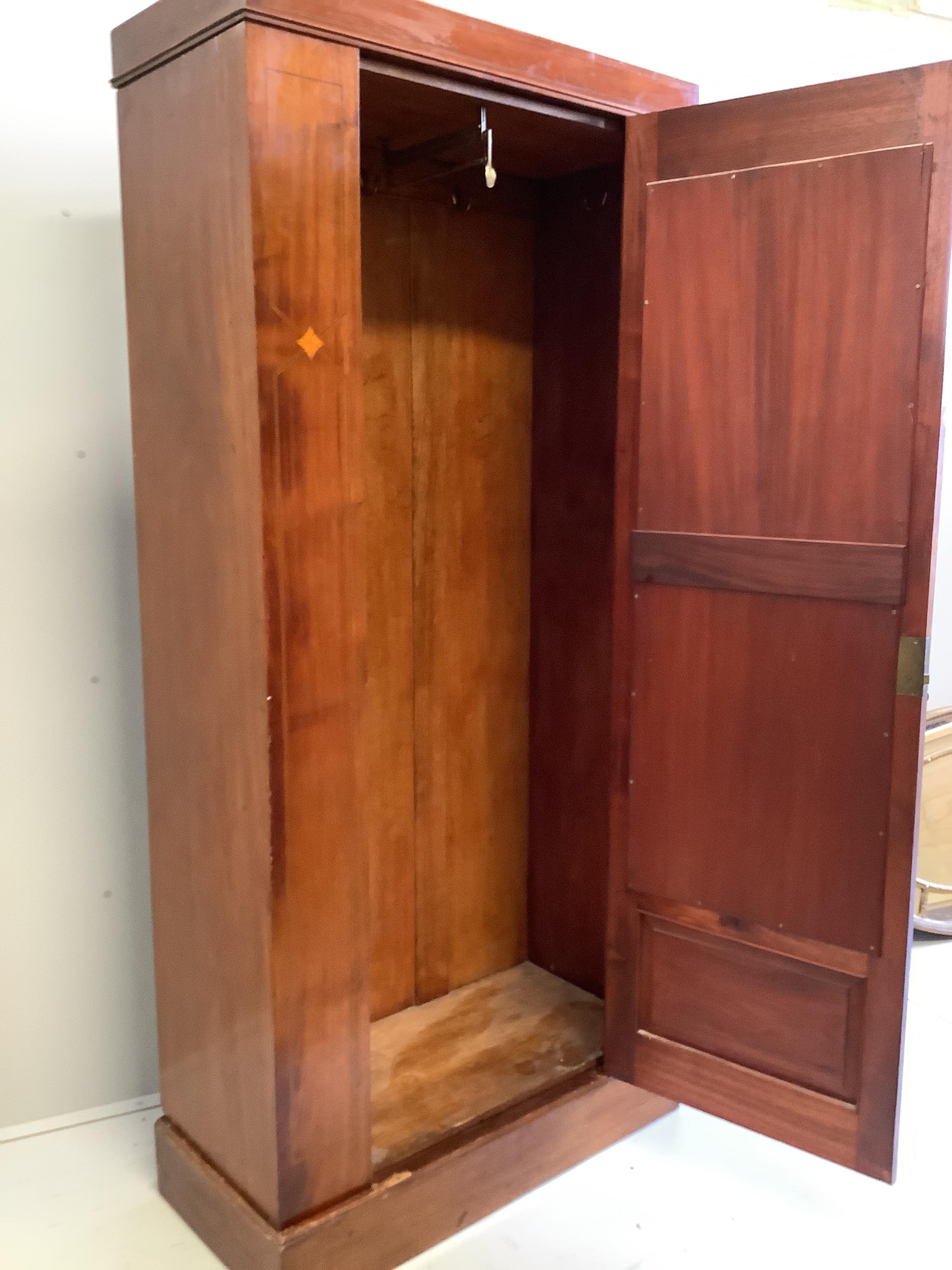 An Edwardian mahogany single wardrobe, width 90cm, depth 43cm, height 196cm